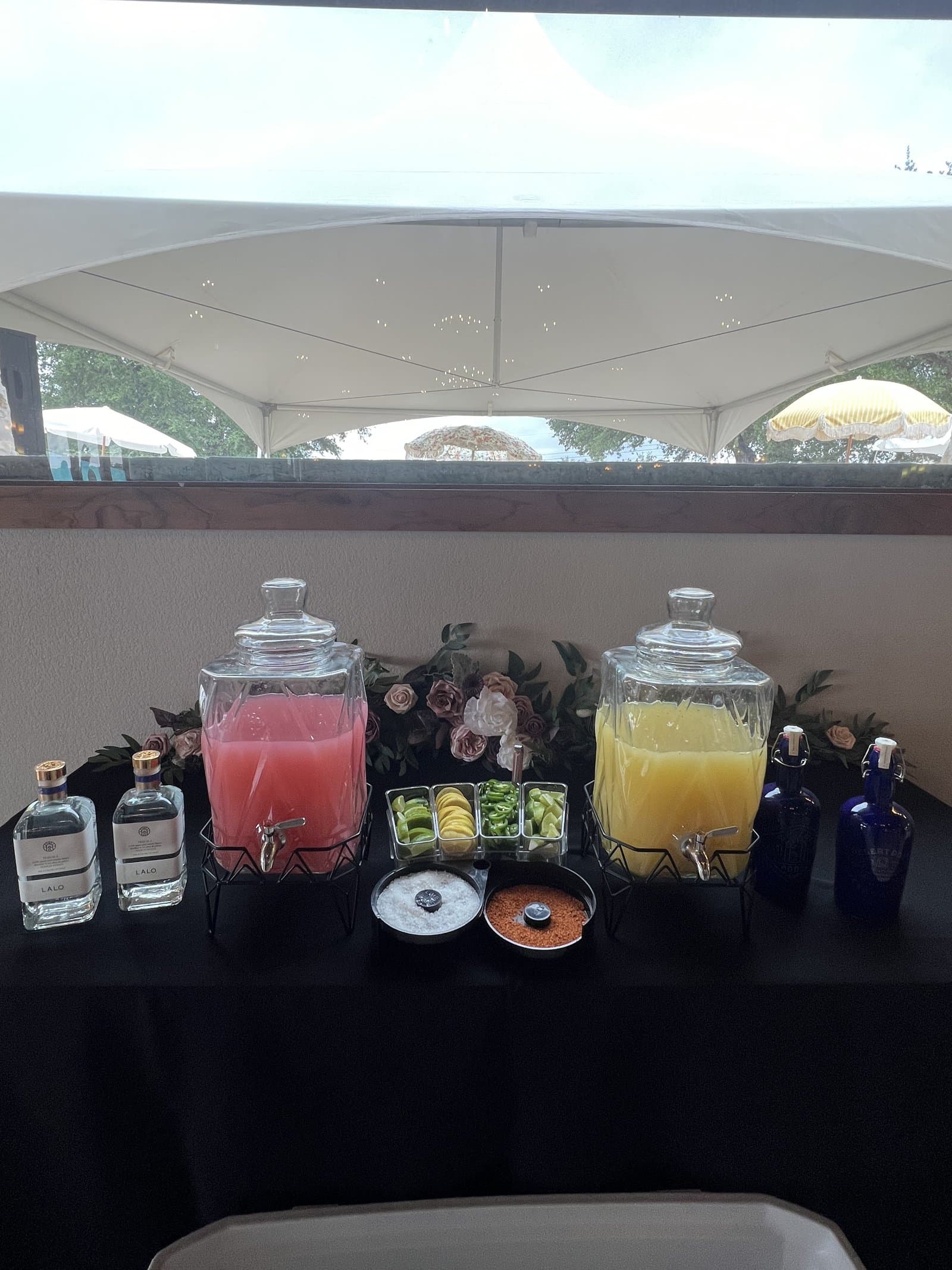 Beverage dispensers with floral arrangements