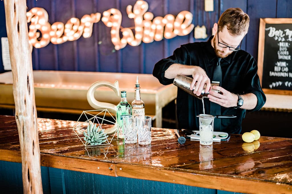 Bartender crafting cocktails at an event