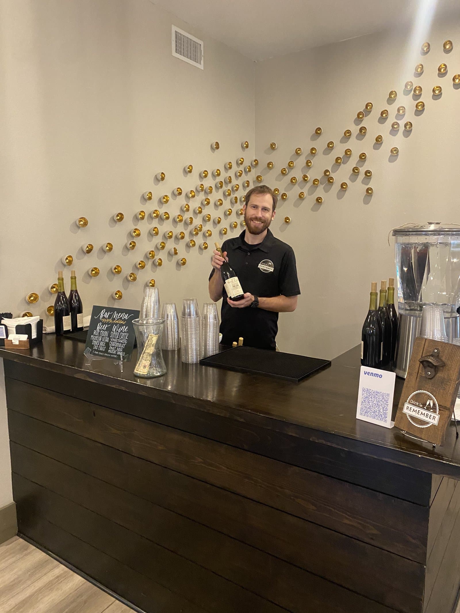 Bartender holding wine glass at event