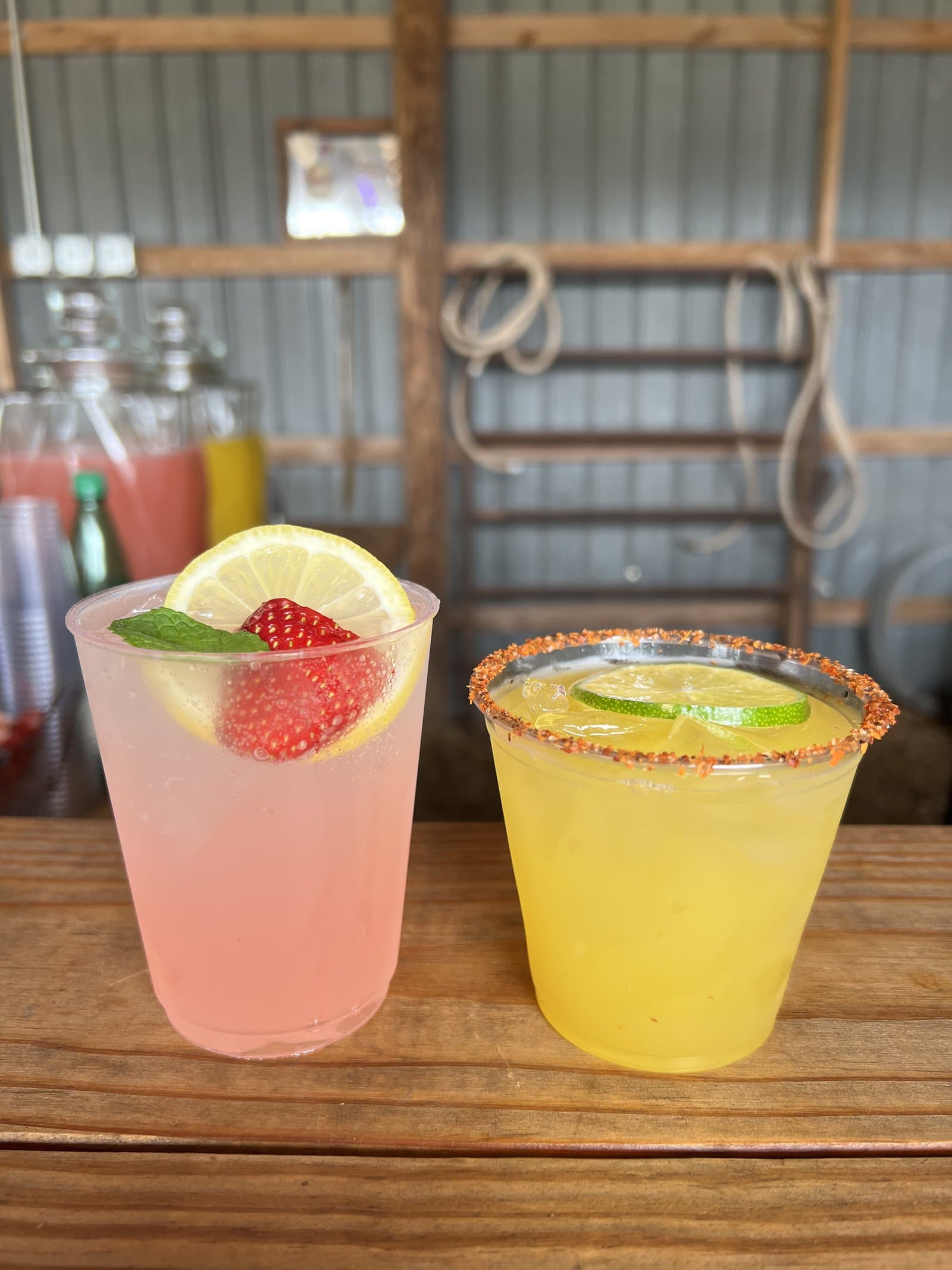 Two signature cocktails — strawberry lemonade and spicy margarita